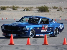 Ed Moss (owner of TCI Engineering) driving his 67 Mustang equipped with RideTech TQ CoilOvers